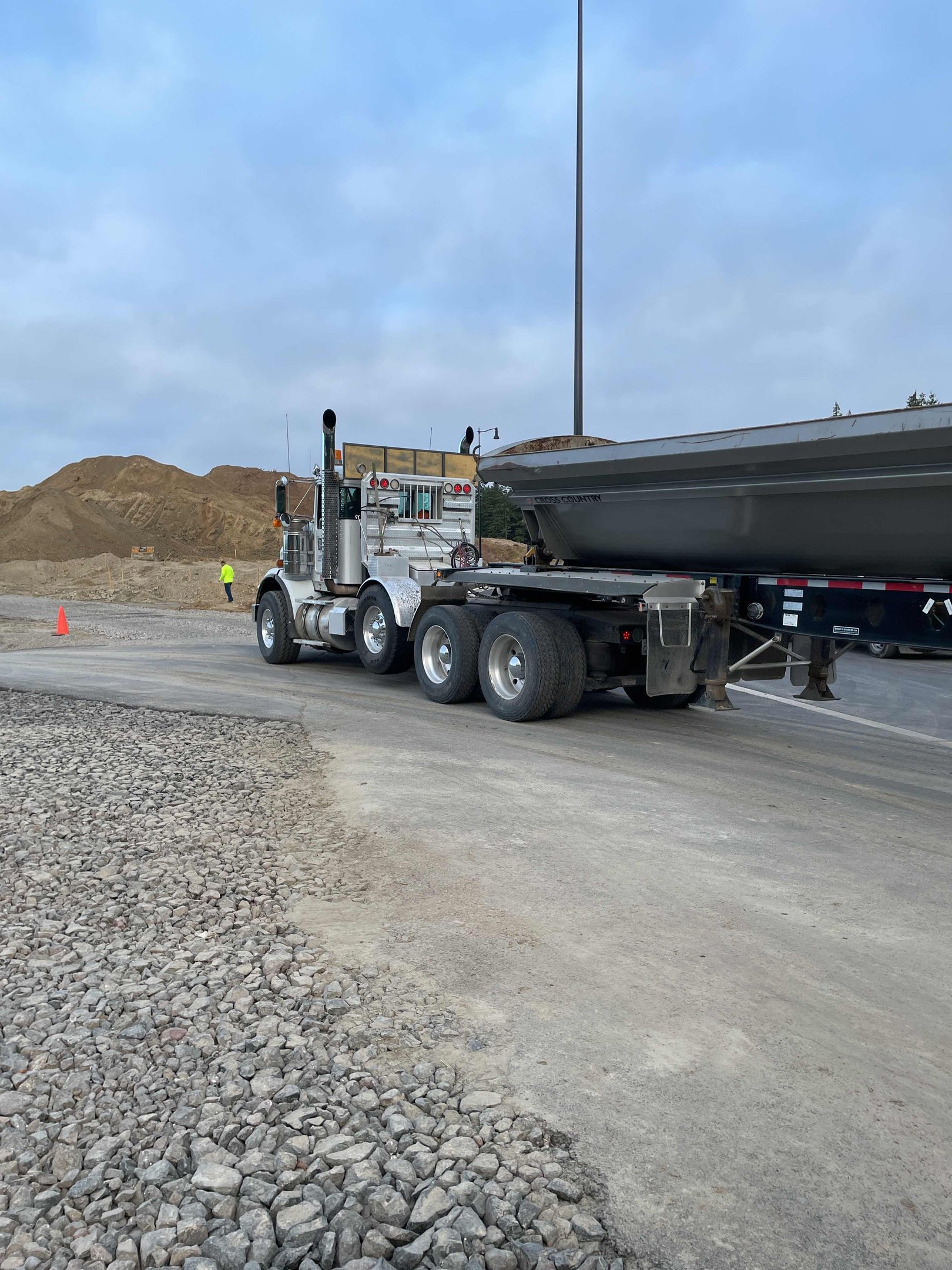 Allegiance side-dump trailer on a highway construction project